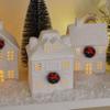 Mark Feldstein & Associates Holiday Wreath Village with Trees, White Unglazed Porcelain LED Christmas Figurines, 18 Piece Set view 4