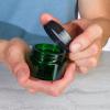 1 oz Green Glass Thick Wall Balm Jars with Black Smooth Foam Lined Lids (12 Pack) view 3
