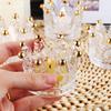 BTGLLAS Set of 24 Crown Glass Tealight Candle Holder,Votive Candle Holders for Wedding, Party, Home Decoration, Jewelry Storage Tray (Glass, Gold24Pcs) view 2