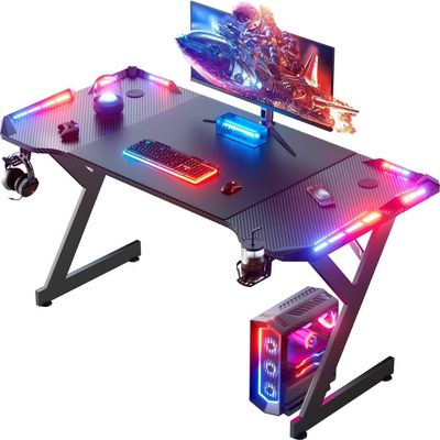 HLDIRECT 55 Inch Gaming Desk with LED Lights, Ergonomic Computer Gaming Table with Carbon Fibre Surface, Sturdy PC Workstation Desk for Home Office with Headphone Hook, Cup Holder, Black
