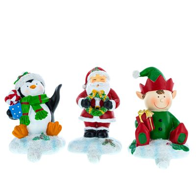 BestPysanky Set of 3 Christmas Stocking Holders Hangers  Santa, Penguin, and Elf Holiday Mantel Decorations