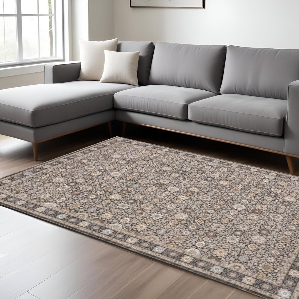 8' X 11' Charcoal Ivory and Beige Floral Power Loom Area Rug with Fringe