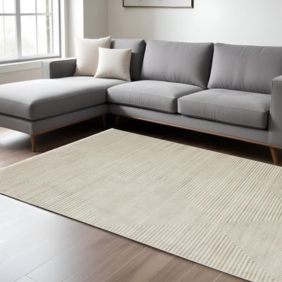 10' X 13' Ivory Beige Taupe and Tan Geometric Power Loom Stain Resistant Area Rug with Fringe