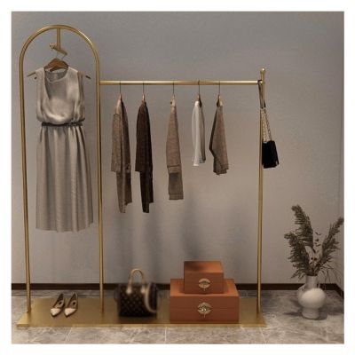 XPLKQXE Simple Rod Metal Garment Rack for Hanging Clothes, Clothes Organizer, Display Stand, Garment Storage Holder with Bottom Mesh Storage Shelf (Color : Gold, Size : 130x40x150cm)