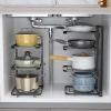 Pot Racks are specifically for pots and Pans, and There are Storage Shelves Under Stainless Steel Shelves in The Kitchen, Multi-Layer Household cabinets, Layered view 1