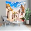 CORFOTO 117x78 Inch Italy Town Street Tapestry Famous Trulli Houses Sunny Blue Sky Italian Street Wall Background for Europe Themed Party Decor Wedding Bedroom Living Room Dorm Wall Hanging view 4