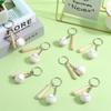 SOFPLATE 12Pcs White Softball Keychains Bulk Wooden Baseball Bat Keychain Mini PU Leather Baseball Bat Keyrings Softball Key Chain Sport Keychains for Party Favors Men Women Athletes Souvenir Birthday view 4