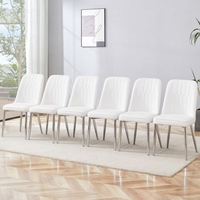 6 Modern Dining Chairs, Sleek PU backrest, and Silver Metal Legs Bring a Comfortable Home Experience to The Kitchen, Bedroom, and Office.White PU Chairs with Simple Line Designs On The Backrest.