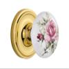 Nostalgic Warehouse Classic Rosette with Rose Porcelain Door Knob, Passage - 2.375", Polished Brass view 1